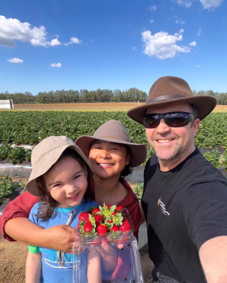 Family photo at Sweet Acres strawberry farm, Wamuran