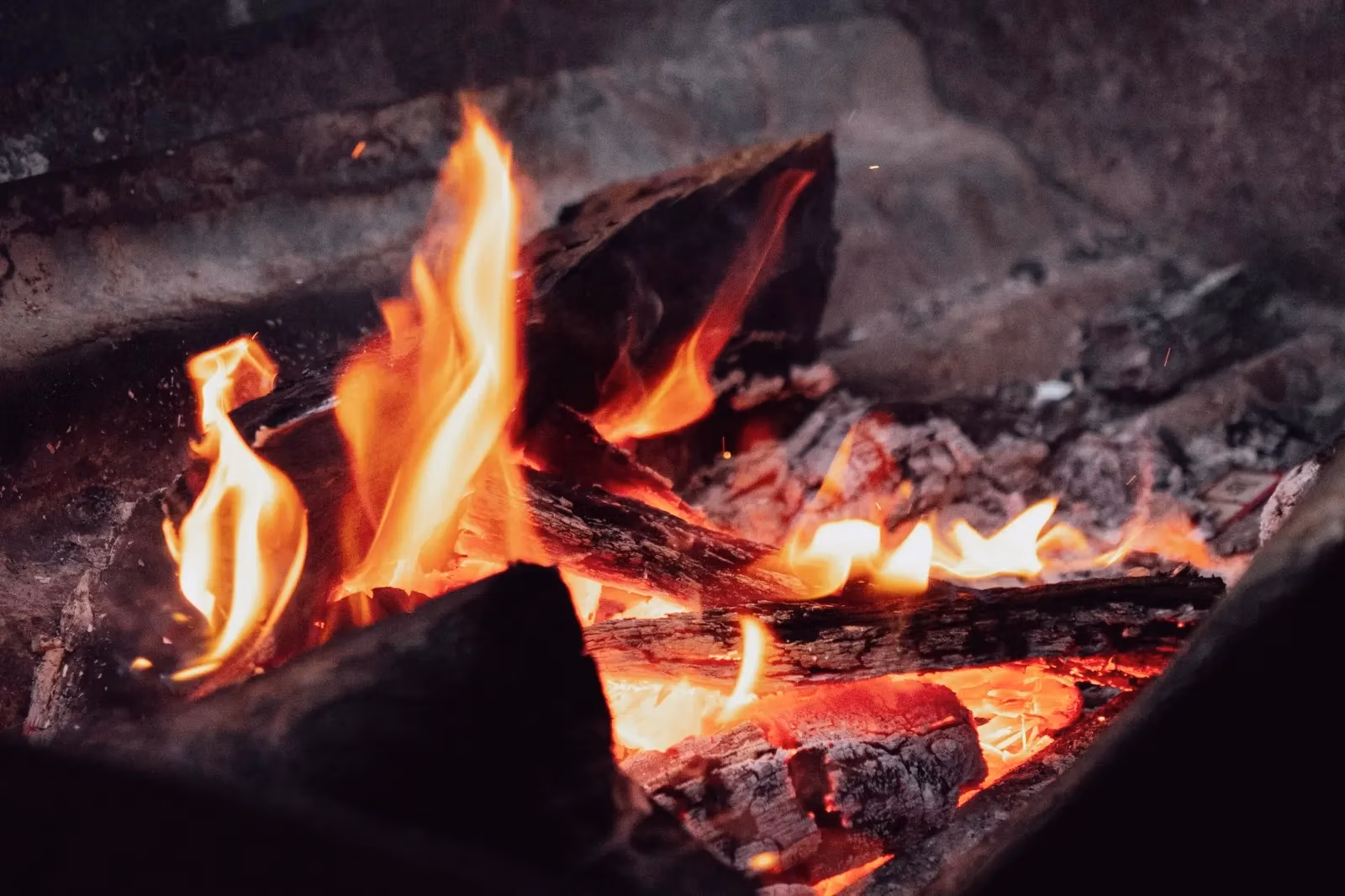 Fire burning in the outdoor fire pit, ready for marshmallow roasting at Worendo Cottages, self-contained family accommodation in the Scenic Rim